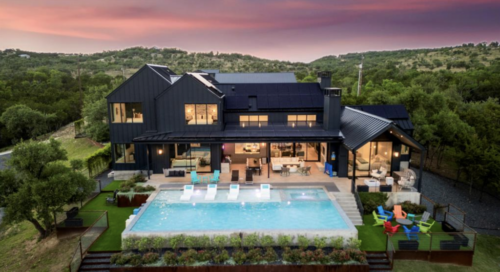 Modern Hill Country estate with expansive outdoor living space, pool, and long-distance views in Dripping Springs Texas